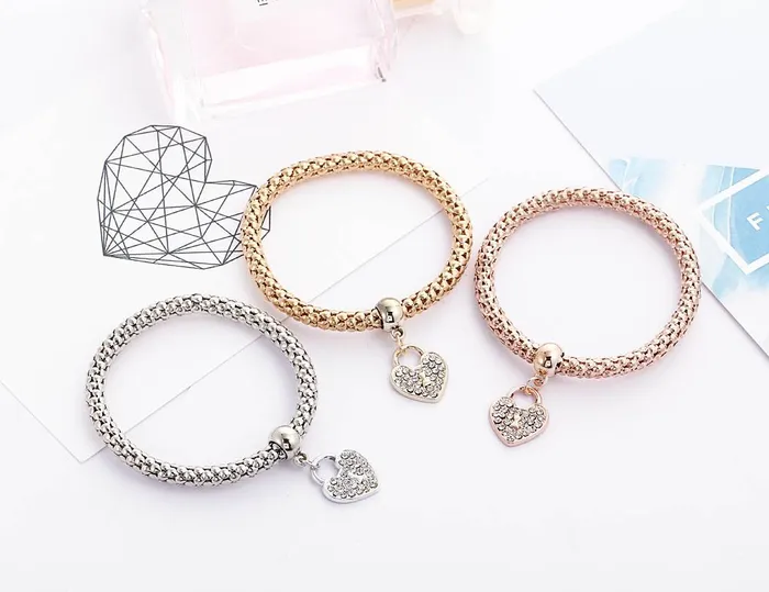 YELLOW CHIMES 3 Pcs Alloy and Australian Crystals Heart Charms Elastic Bangles and Bracelet for Women Girls Free Size Yellow Chimes Bracelets