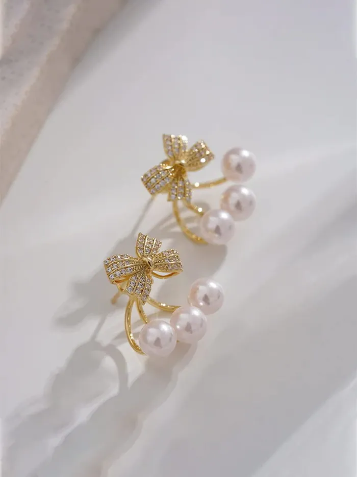 Yellow Chimes Rings Yellow Chimes Earrings For Women Gold Tone Crystal Studded Bow Shaped Stud Pearl Drop Earrings For Women and Girls